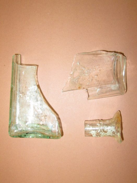 Glass bottle fragments found in excavation